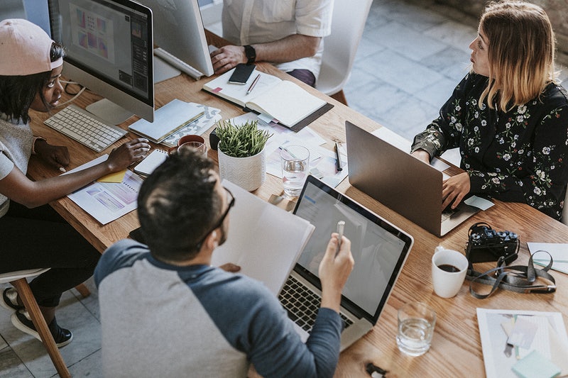 Business people working together using digital devices